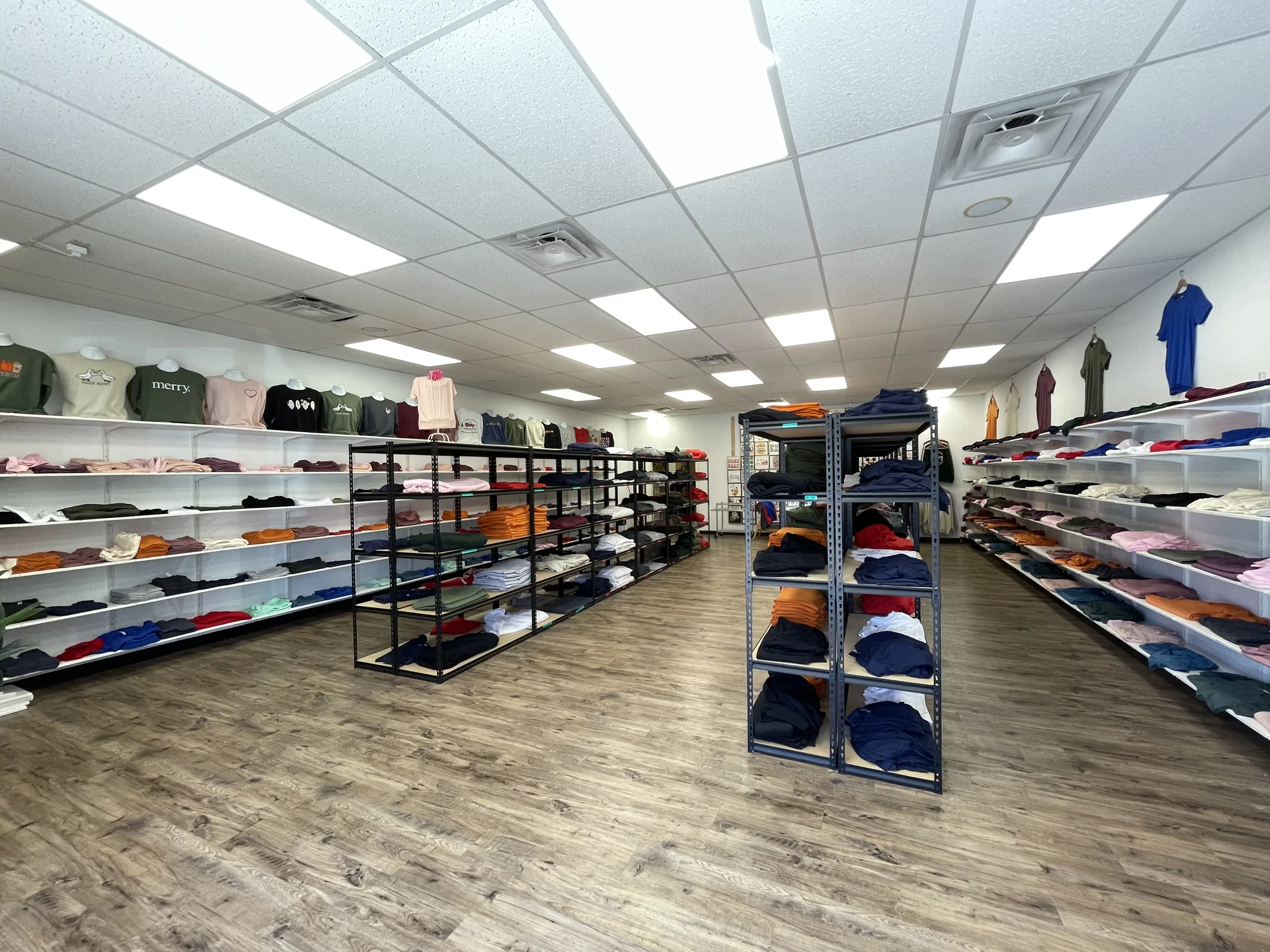 Blank apparel shelves at the Raccoon Print store in Spring, Texas